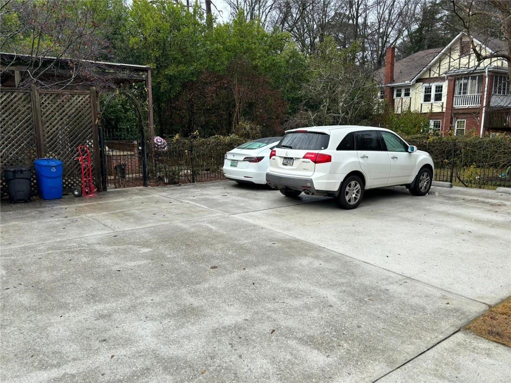 544 East Ponce De Leon Avenue, Unit TERRACE Decatur, GA 30030 - Photo 13 of 18 a view of car parked in parking lot of house