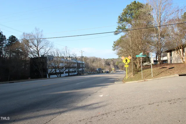 a view of a street with a building in the background