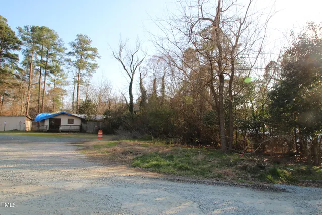 a view of street with parked cars