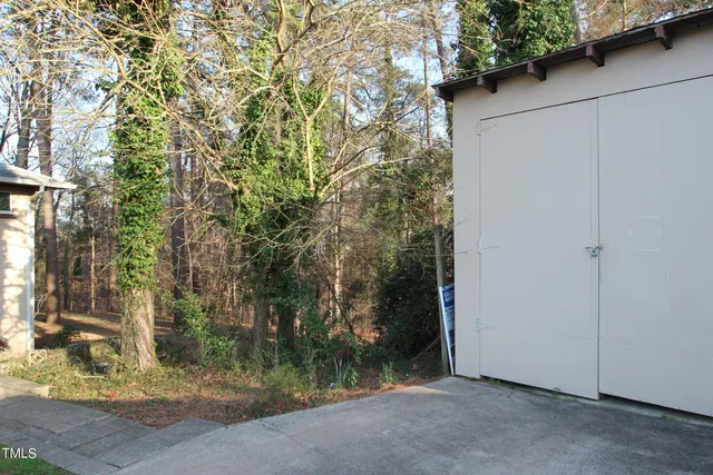 a view of a house with a tree