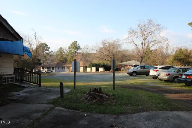 a view of a park with houses