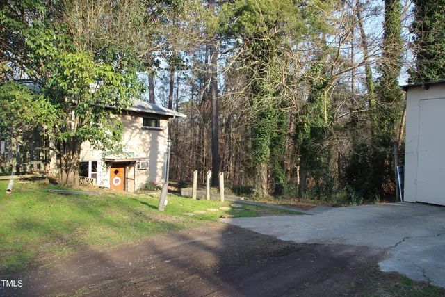 a view of a trees with a yard