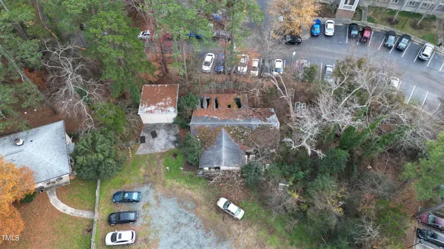 an aerial view of a house with a yard