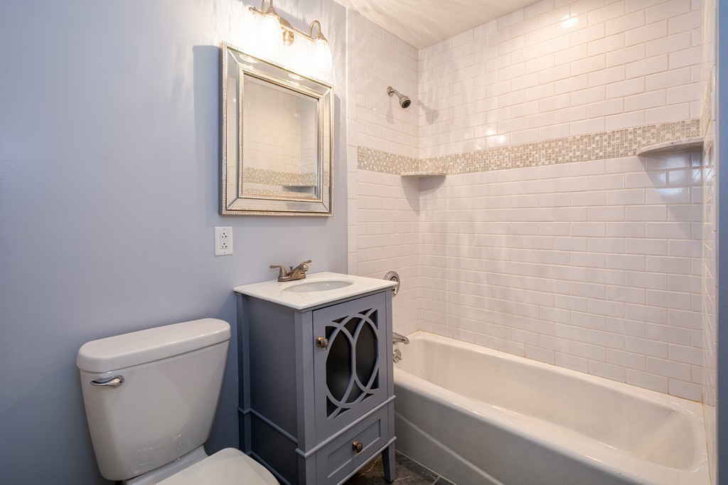 201 Beaver Dam Road Scituate, MA 02066 - Photo 11 of 21 a bathroom with a granite countertop toilet sink and mirror