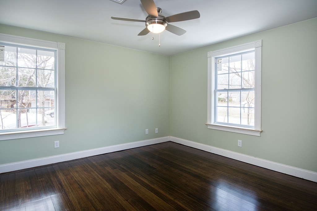 201 Beaver Dam Road Scituate, MA 02066 - Photo 16 of 21 a view of empty room with wooden floor and fan