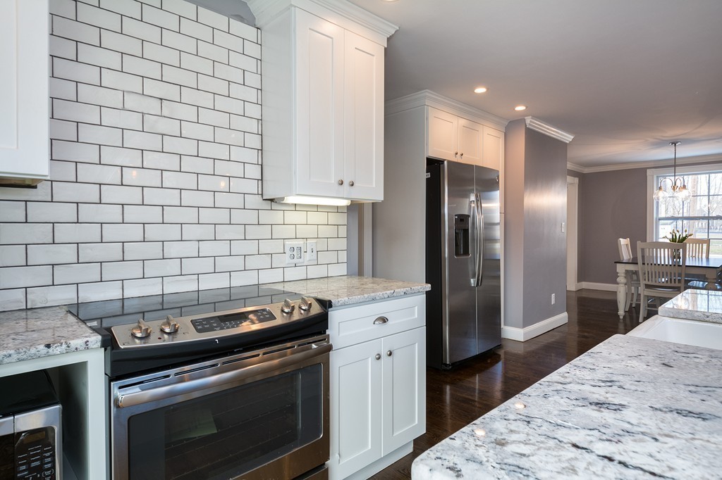 201 Beaver Dam Road Scituate, MA 02066 - Photo 3 of 21 a kitchen with a stove and a refrigerator