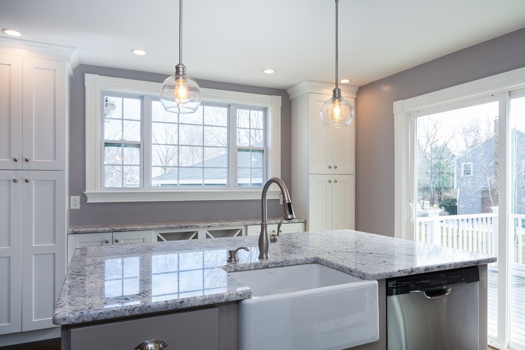 201 Beaver Dam Road Scituate, MA 02066 - Photo 4 of 21 a kitchen with granite countertop a sink and a window