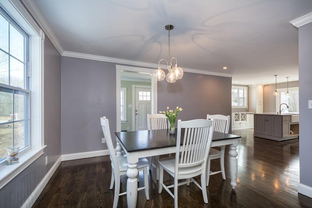 201 Beaver Dam Road Scituate, MA 02066 - Photo 5 of 21 a view of a dining room with furniture window and wooden floor