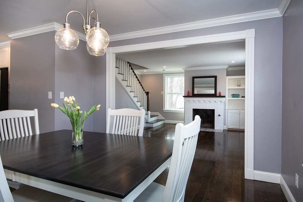 201 Beaver Dam Road Scituate, MA 02066 - Photo 6 of 21 a view of kitchen and dining area with a fireplace