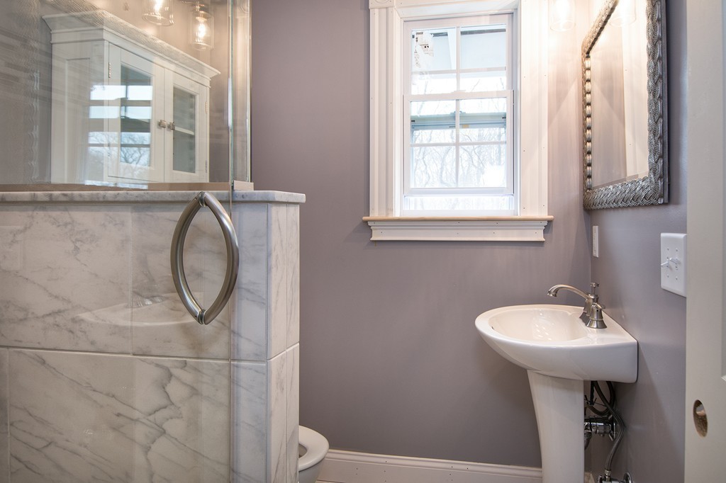 201 Beaver Dam Road Scituate, MA 02066 - Photo 10 of 21 a bathroom with a sink a toilet and a mirror
