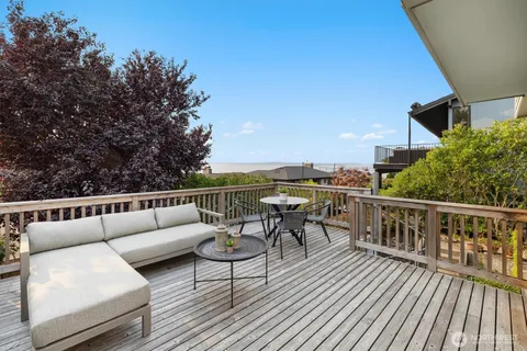 a view of roof deck with furniture