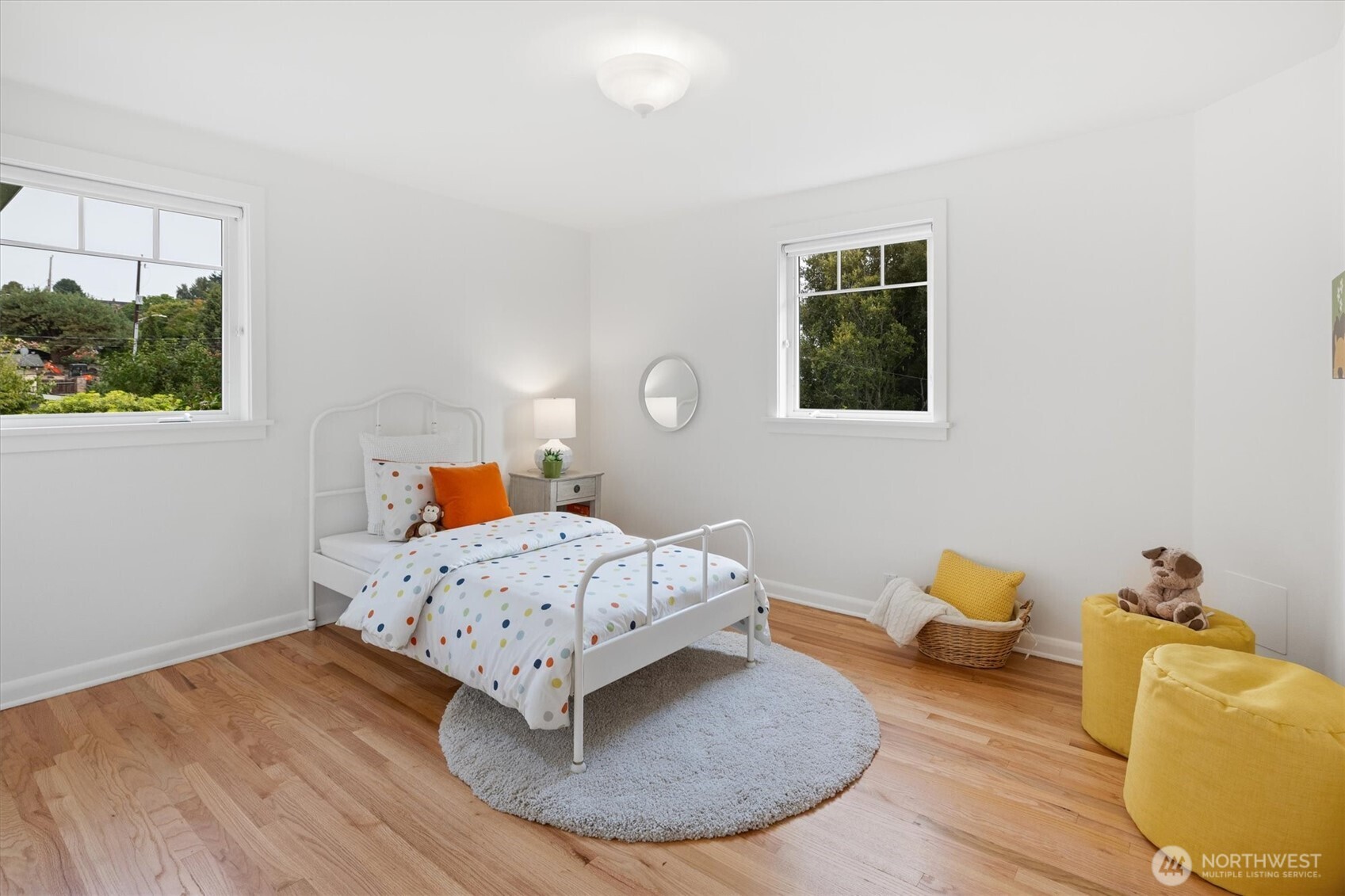 6703 36th Avenue Northwest Seattle, WA 98117 - Photo 16 of 40 a living room with furniture and a wooden floor