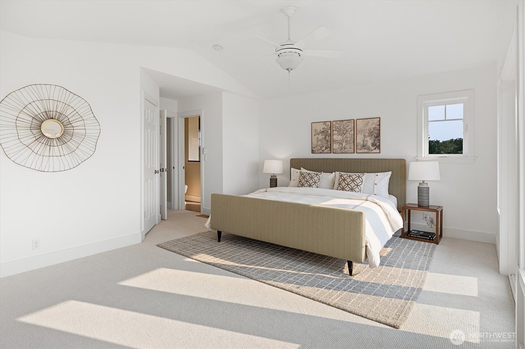 6703 36th Avenue Northwest Seattle, WA 98117 - Photo 21 of 40 a bedroom with a bed and a window