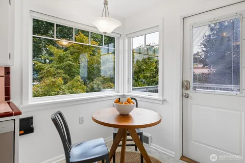 a view of a dining room with furniture window and outside view