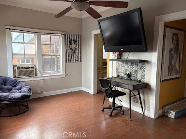 a view of a livingroom with furniture and a flat screen tv
