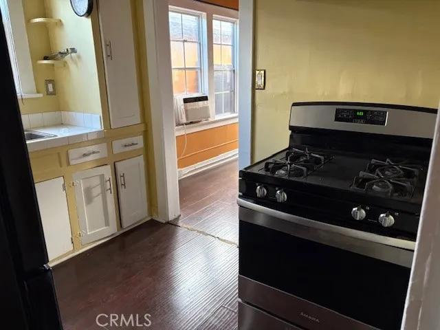 a kitchen with a stove and a refrigerator