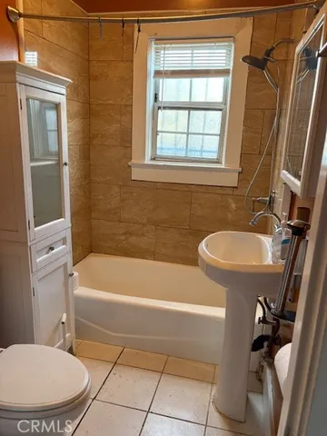 a bathroom with a sink a toilet and a bathtub