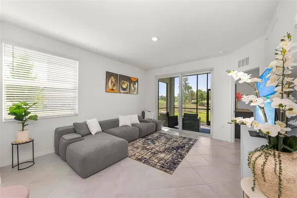 a living room with furniture and a window