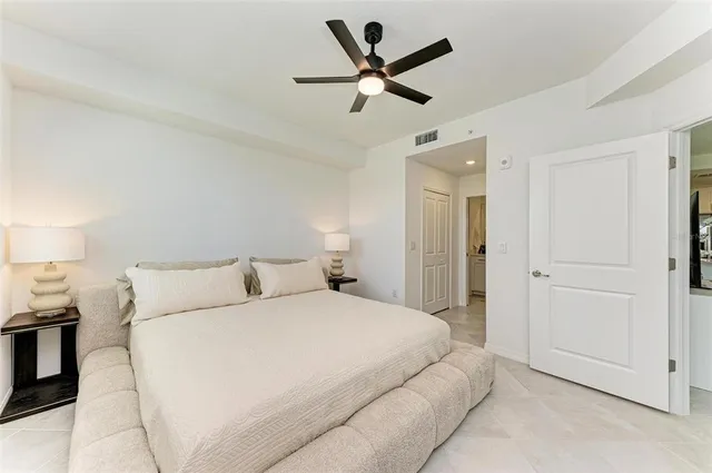 a bedroom with a bed and a dresser