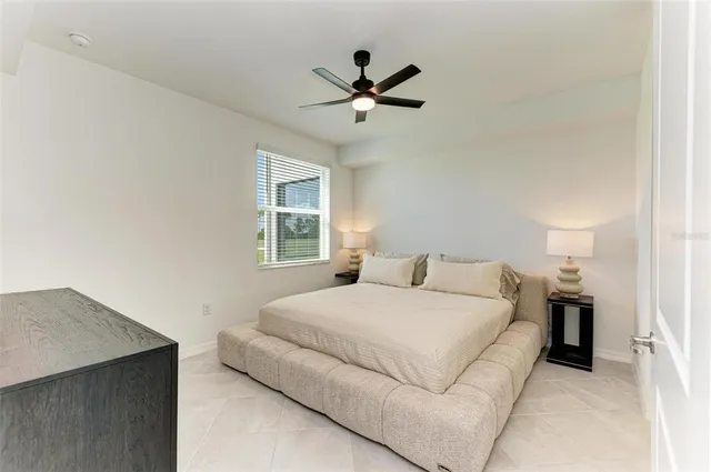 a front view of a house with a garden and hanging chair