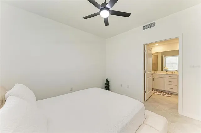 a front view of a house with garden and plants