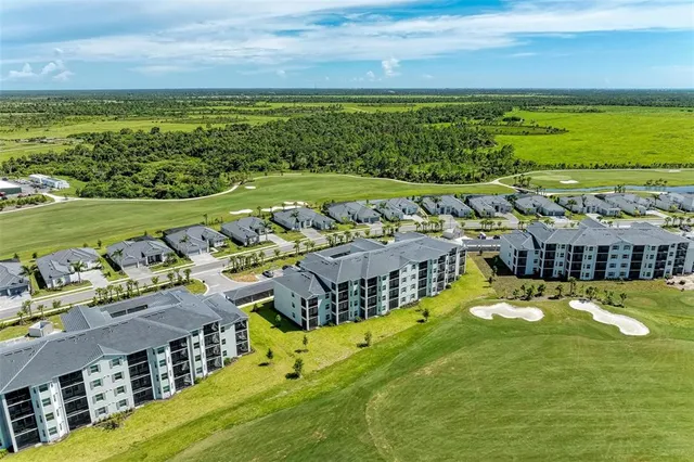 a view of a patio with table and chairs and potted plants