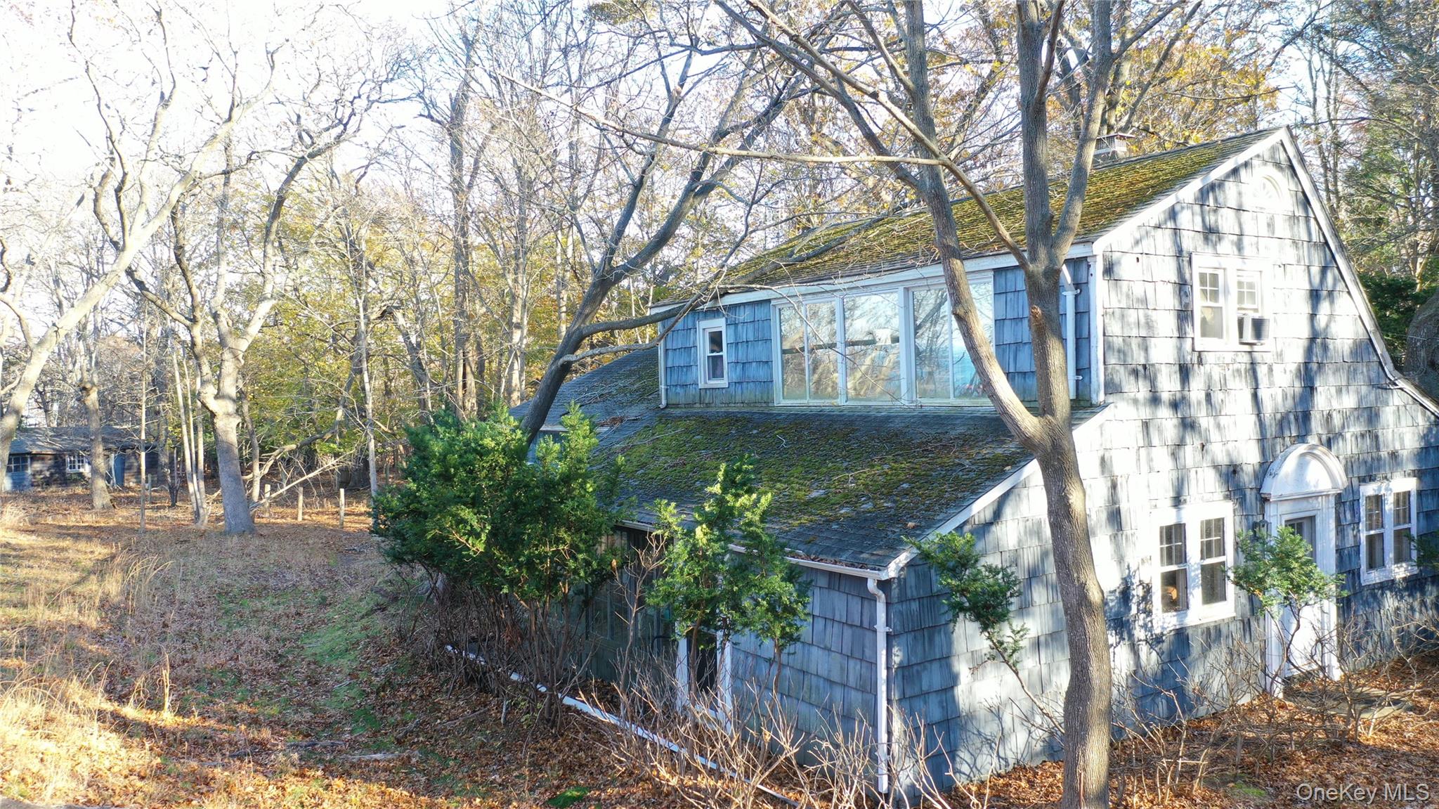 2788 North Wading River Road Wading River, NY 11792 - Photo 6 of 13 a front view of a house with a yard