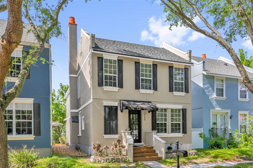 2165 Ridgewood Street Orlando, FL 32803 - Photo 2 of 37 a front view of a building with garden