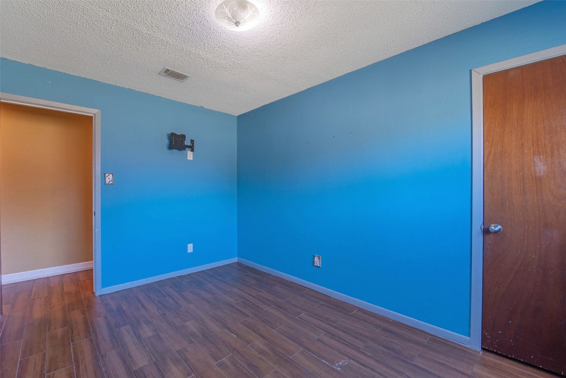 504 Raymond Street La Marque, TX 77568 - Photo 20 of 22 a view of empty room with wooden floor