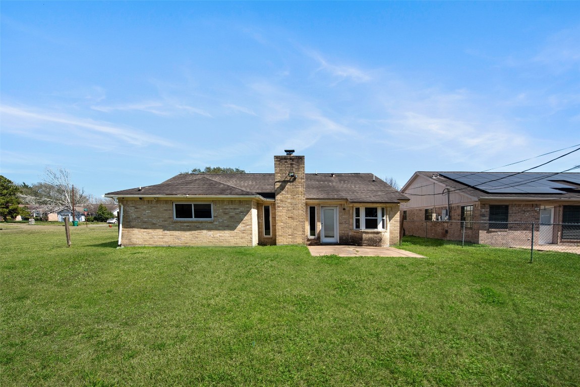 504 Raymond Street La Marque, TX 77568 - Photo 4 of 22 a front view of a house with a yard
