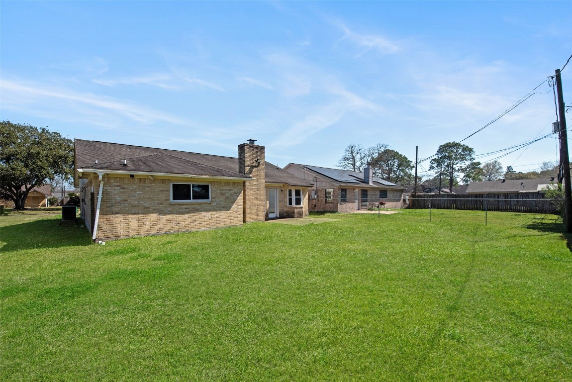 504 Raymond Street La Marque, TX 77568 - Photo 5 of 22 a front view of house with yard and green space