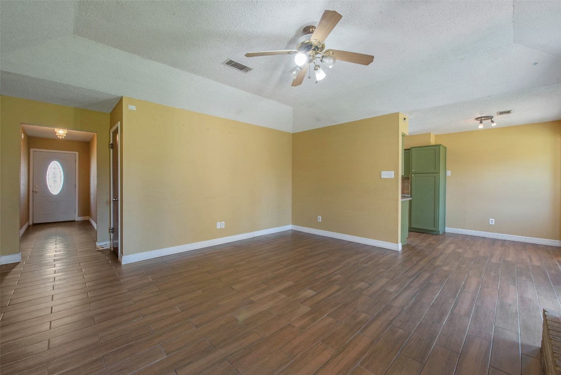504 Raymond Street La Marque, TX 77568 - Photo 8 of 22 a view of an empty room with wooden floor