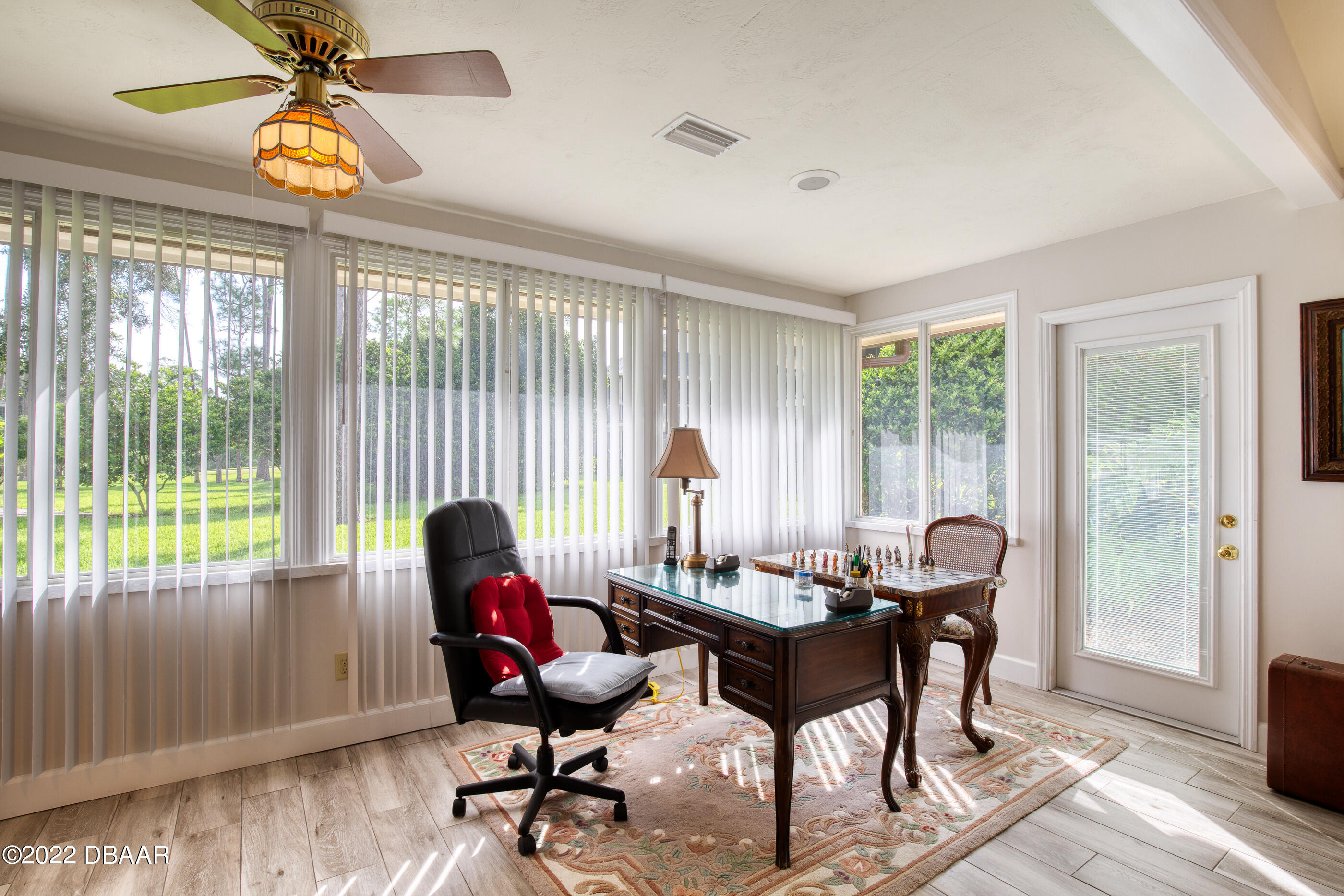 4 Jasmine Run Ormond Beach, FL 32174 - Photo 16 of 18 a work room with furniture and wooden floor