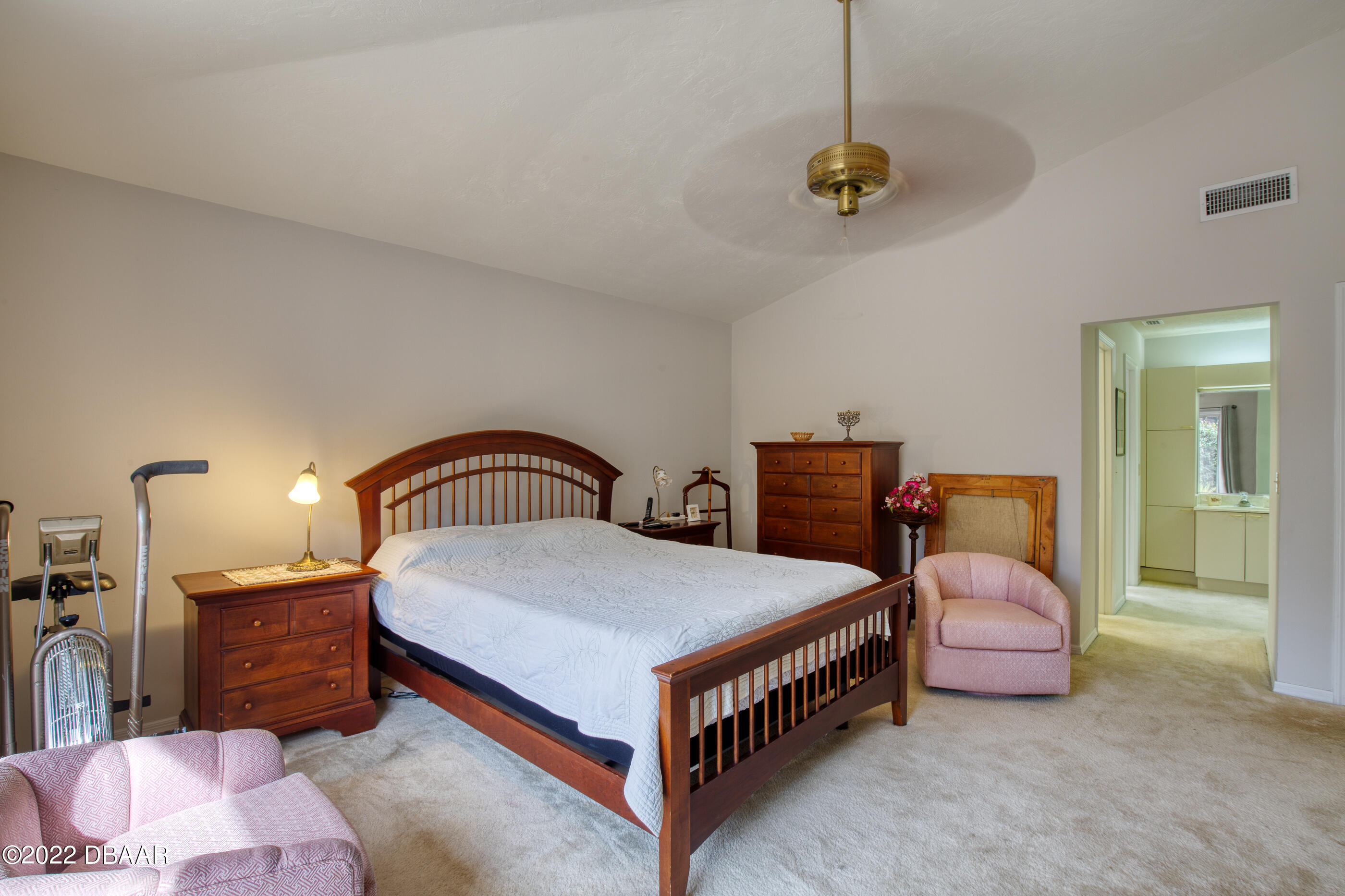 4 Jasmine Run Ormond Beach, FL 32174 - Photo 17 of 18 a bedroom with a bed and dresser