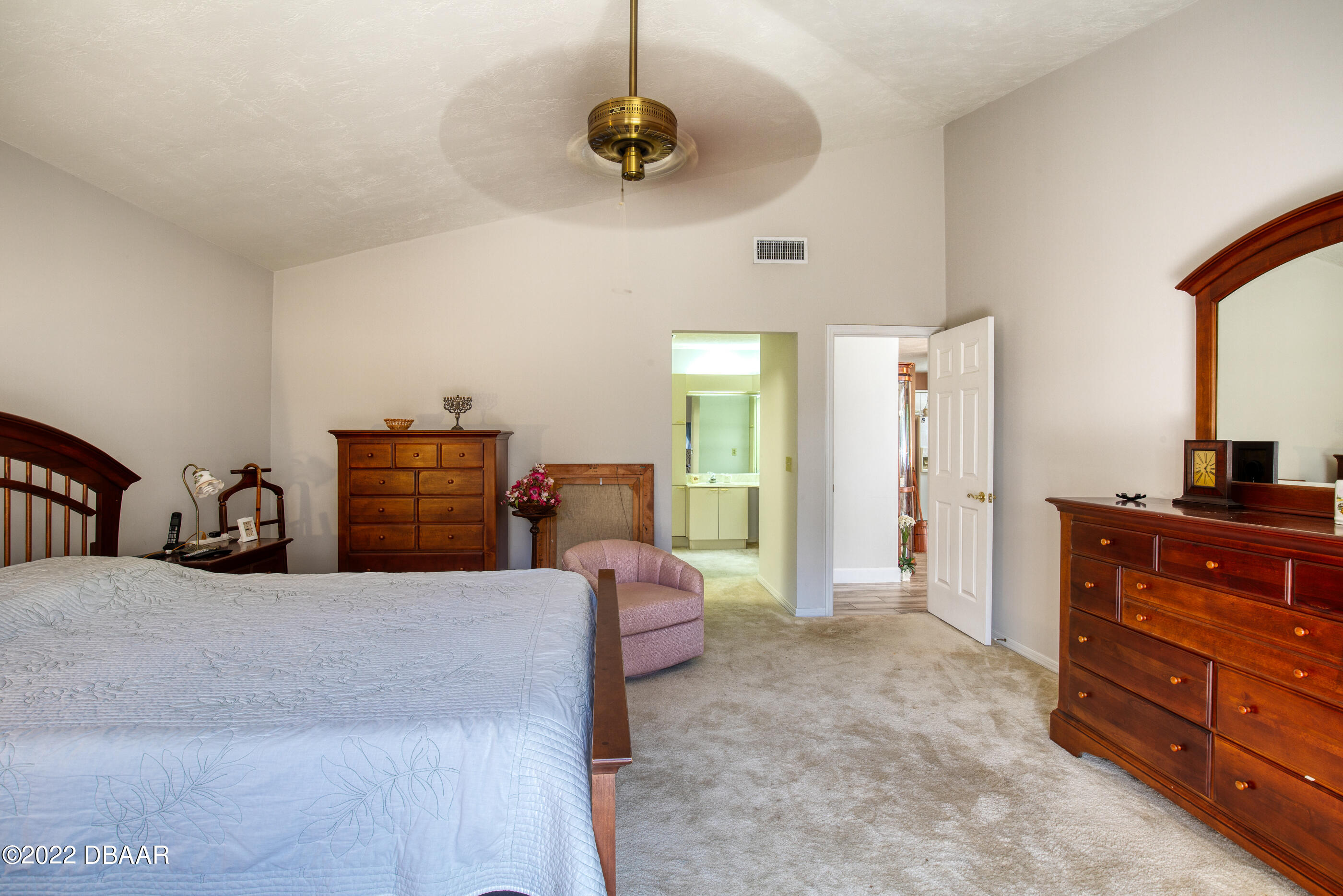 4 Jasmine Run Ormond Beach, FL 32174 - Photo 18 of 18 a living room with furniture and a dresser
