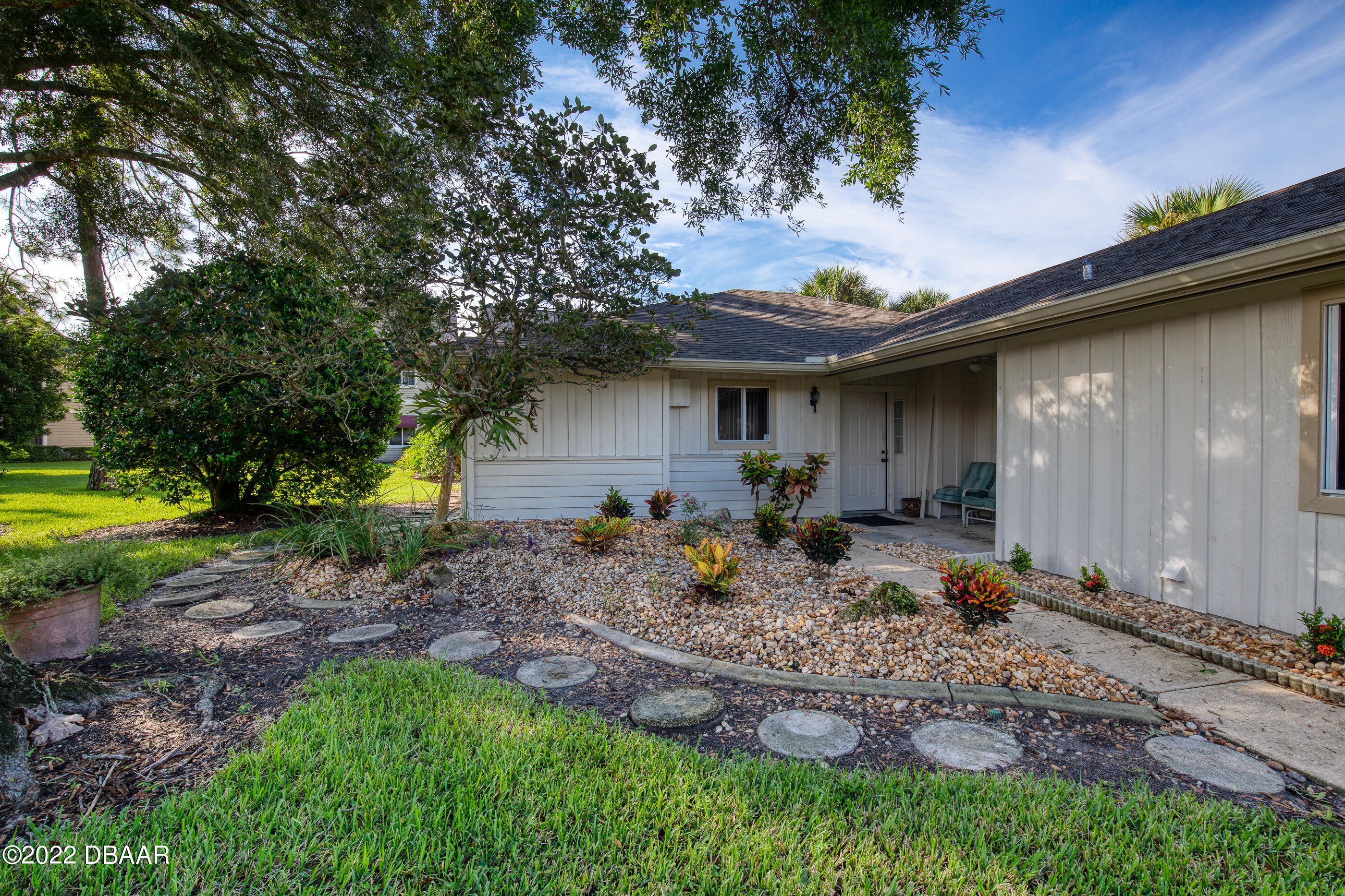 4 Jasmine Run Ormond Beach, FL 32174 - Photo 3 of 18 a view of a house with backyard and sitting area