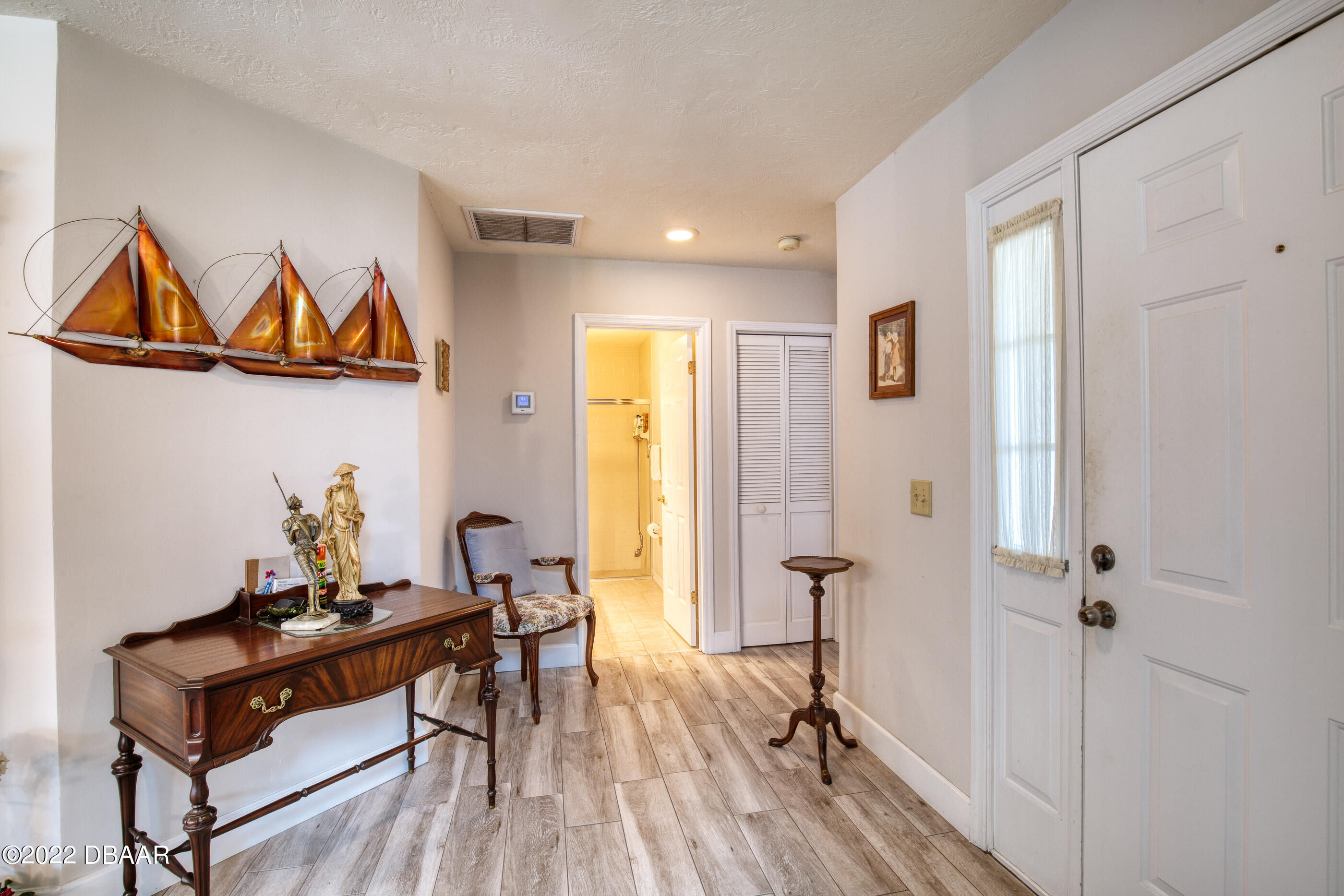 4 Jasmine Run Ormond Beach, FL 32174 - Photo 5 of 18 a room with gym equipment and wooden floor