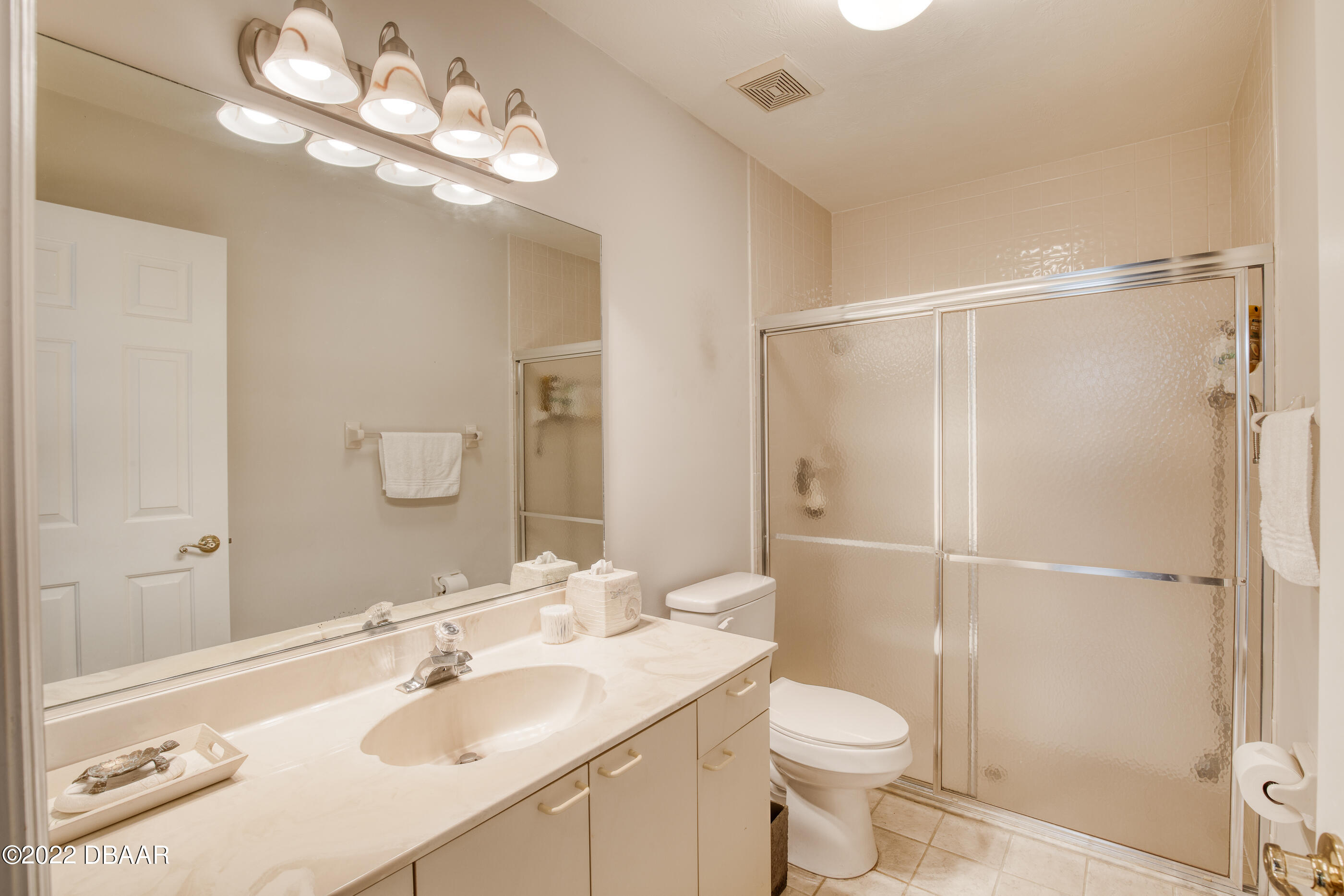 4 Jasmine Run Ormond Beach, FL 32174 - Photo 6 of 18 a bathroom with a sink a toilet and shower
