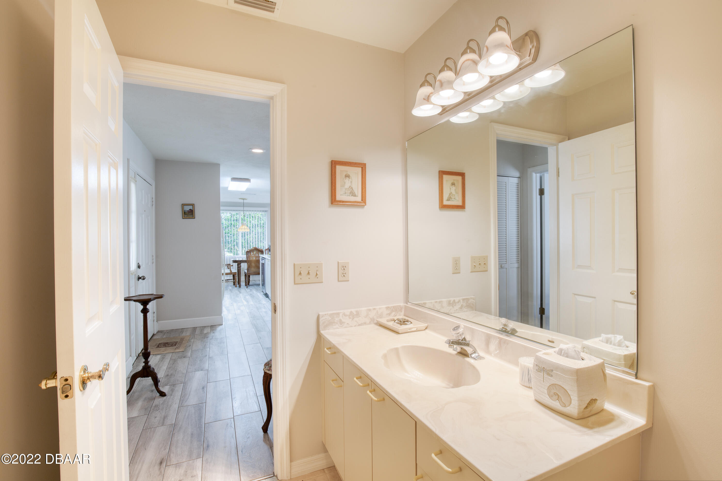 4 Jasmine Run Ormond Beach, FL 32174 - Photo 7 of 18 a en suite bathroom with a sink double vanity and a mirror
