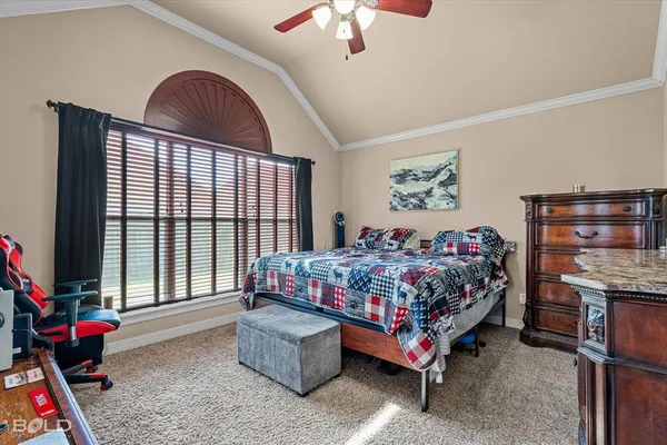 a bed room with a bed and a chandelier