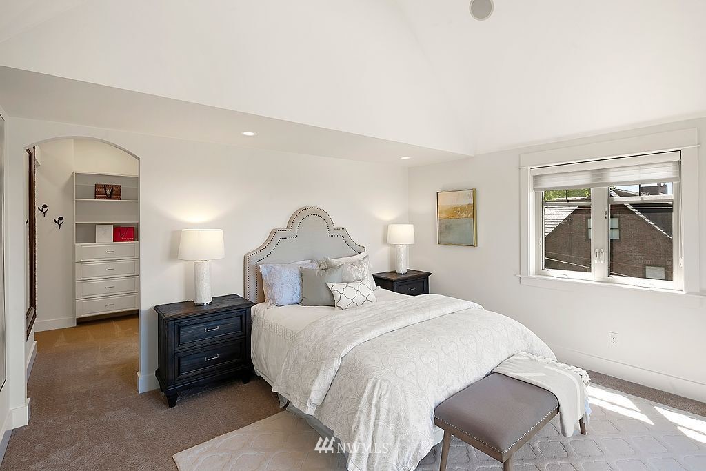 2801 28th Avenue West Seattle, WA 98199 - Photo 22 of 39 a bedroom with bed and wooden floor