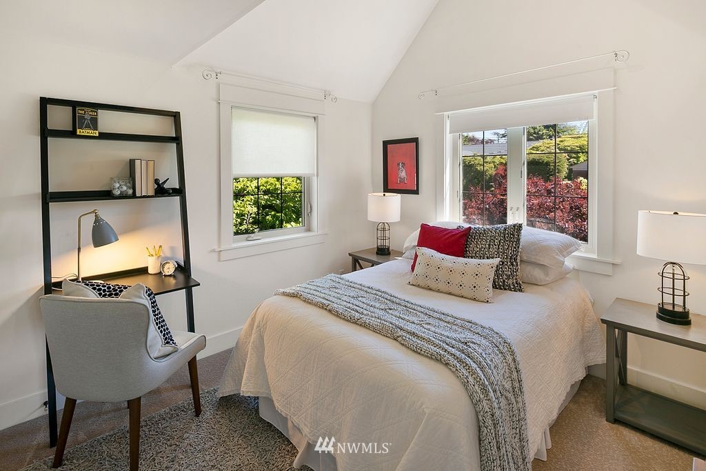 2801 28th Avenue West Seattle, WA 98199 - Photo 25 of 39 a bedroom with a bed a desk and chair