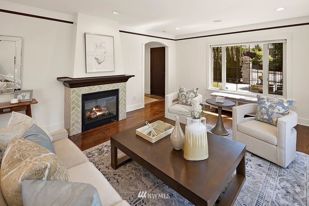 2801 28th Avenue West Seattle, WA 98199 - Photo 5 of 39 a living room with furniture and a fireplace