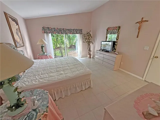 a spacious bathroom with a double vanity sink and a mirror