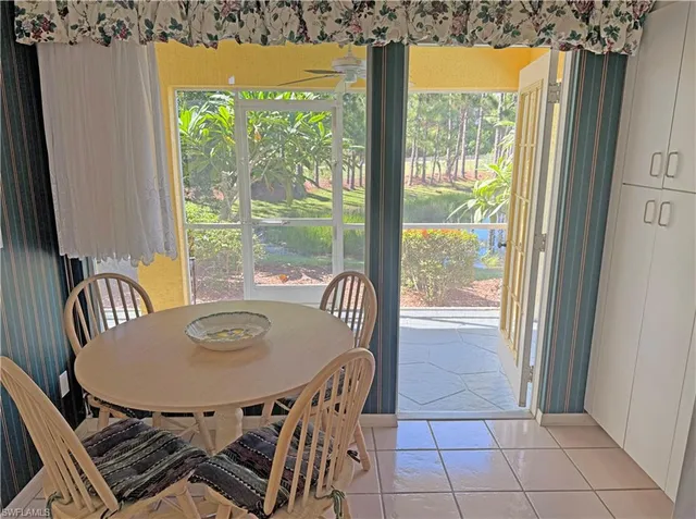 a view of a backyard with sitting area