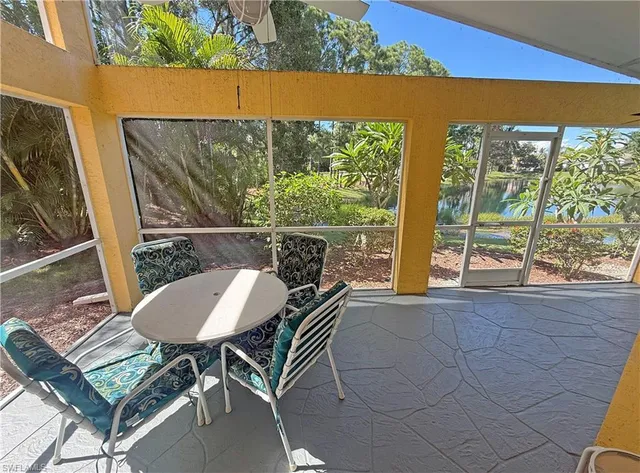a view of a lake with a house in the background