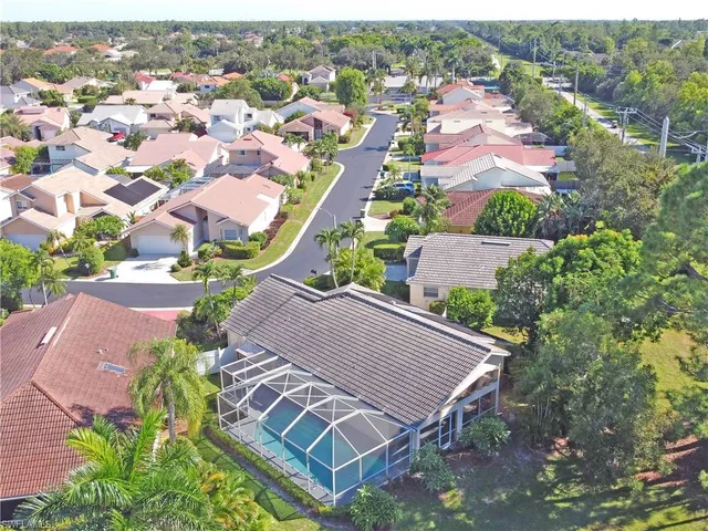 an aerial view of a house with outdoor space