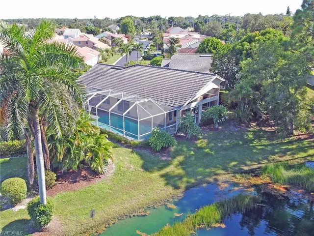 a view of a lake with a yard