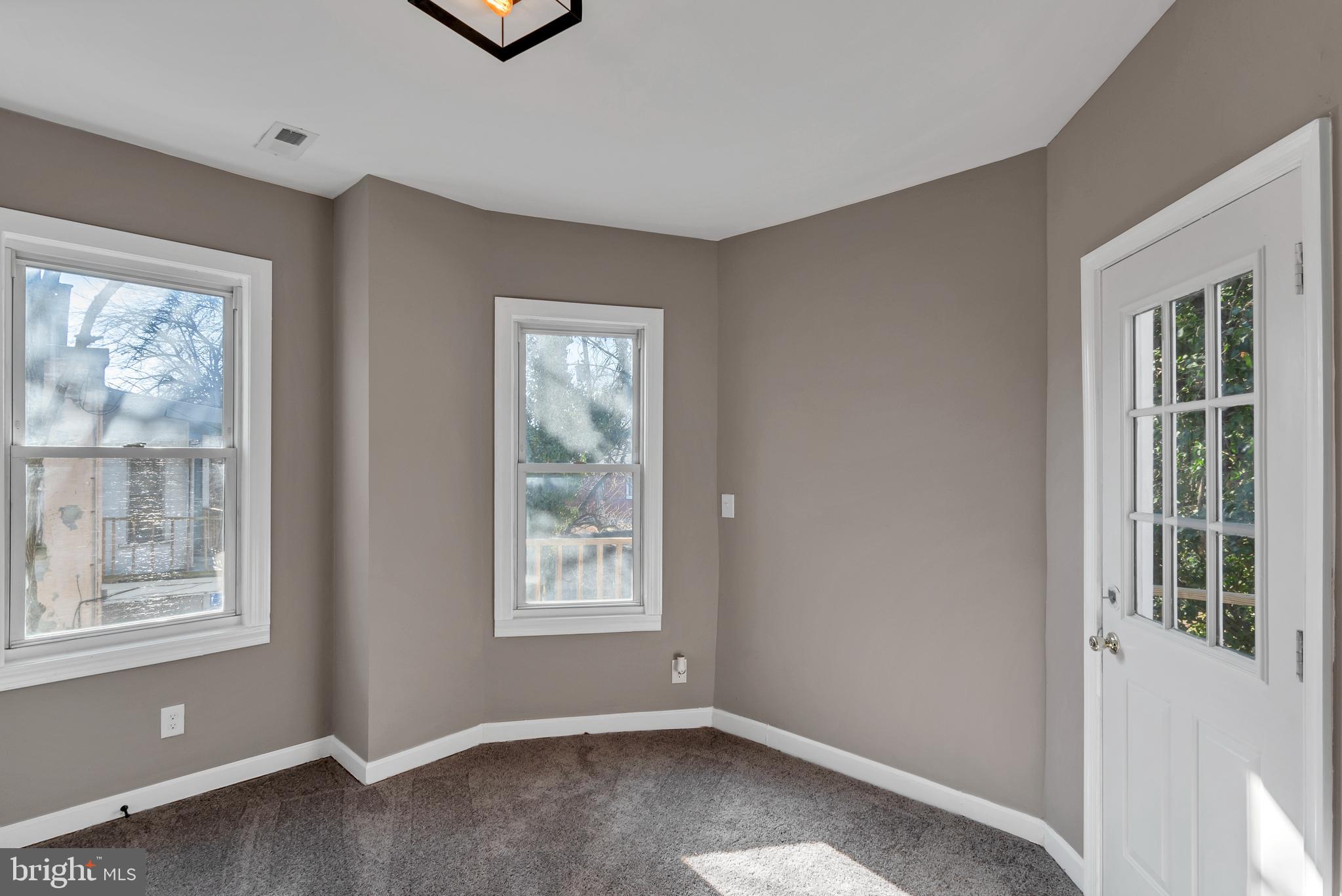12 South Augusta Avenue Baltimore, MD 21229 - Photo 12 of 38 a view of an empty room with a window
