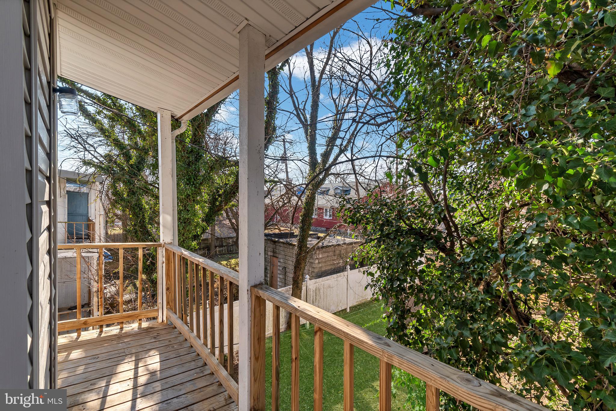 12 South Augusta Avenue Baltimore, MD 21229 - Photo 13 of 38 a view of a balcony with wooden floor